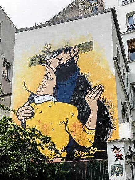 An Artful Gardener Tin Tin and Captain Haddock embrace on a wall in Paris