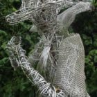 An Artful Gardener Garden Art Wire Figure Flute Player head and shoulders portrait