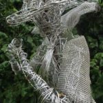 An Artful Gardener Garden Art Wire Figure Flute Player head and shoulders portrait