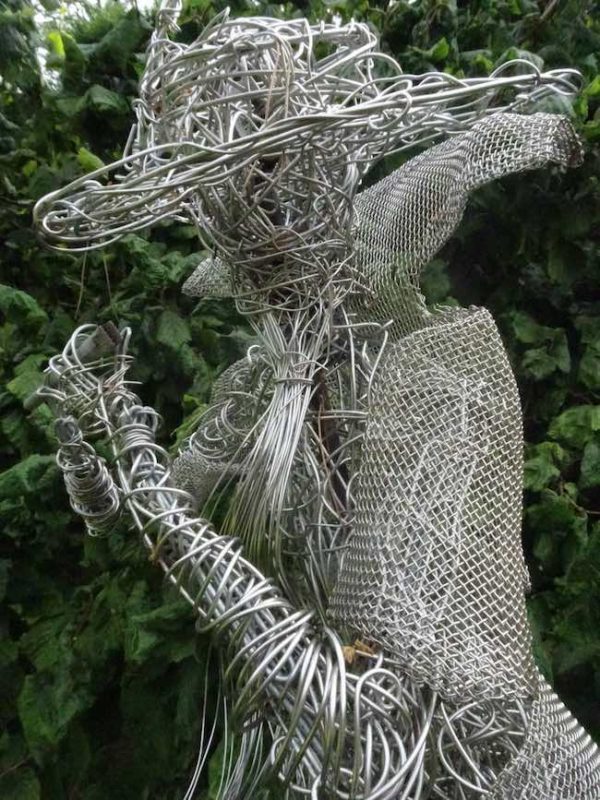 An Artful Gardener Garden Art Wire Figure Flute Player head and shoulders portrait