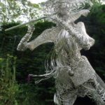 An Artful Gardener Garden Art Wire Figure Flute Player portrait