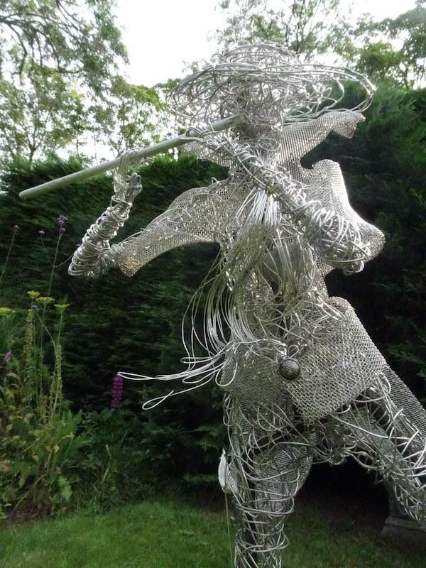 An Artful Gardener Garden Art Wire Figure Flute Player portrait