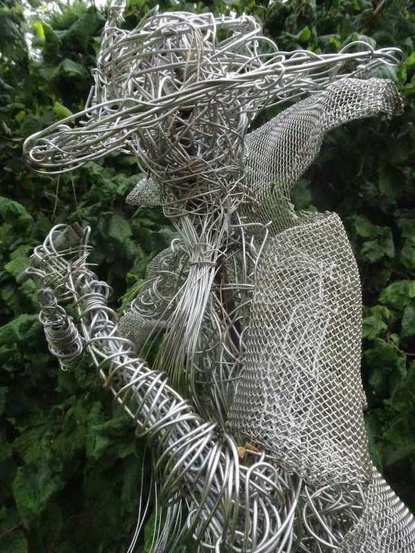 An Artful Gardener Garden Art Wire Figures Flute Player head and shoulders side portrait